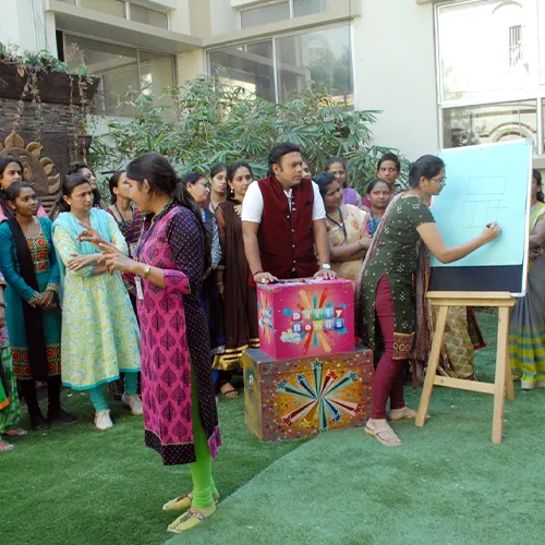 Students at a drawing activity during the centenary