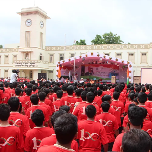 Students gathered in front of the D.N. High School building during the centenary